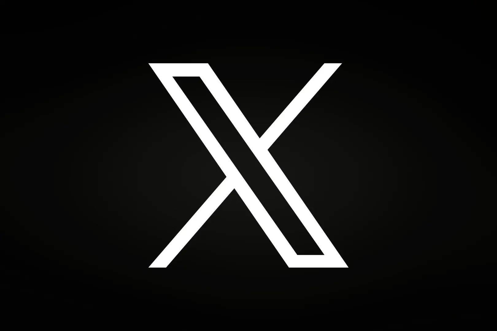 Белая буква X на черном фоне