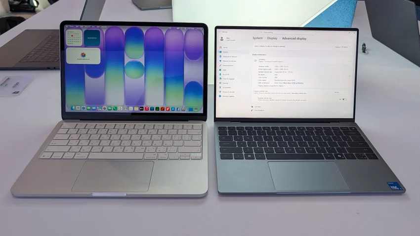 MacBook Neo и Dell XPS 13 на столе. Экраны с macOS и Windows.